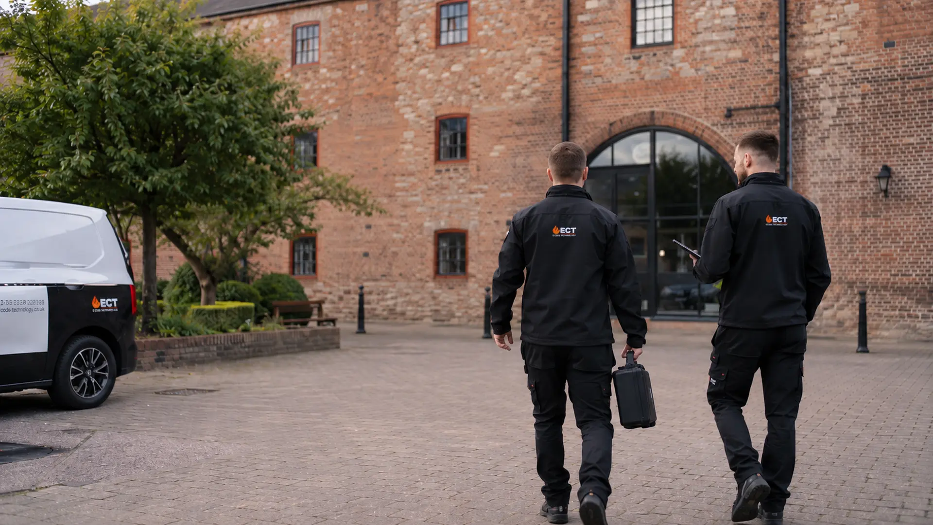 ECT fire and security engineers approaching commercial premises in Pershore